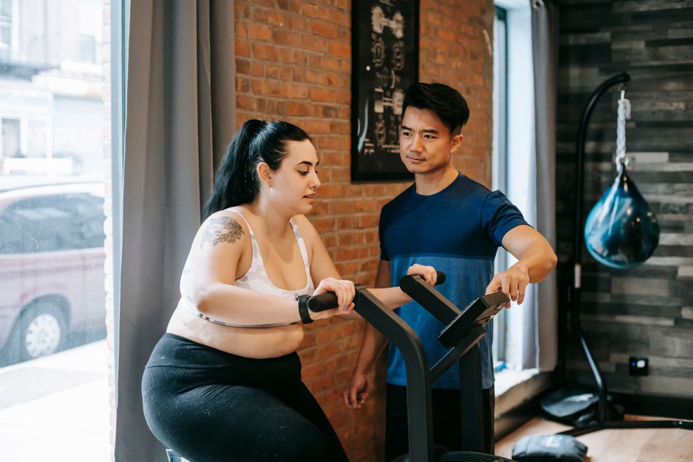 Personal trainer coaching a client